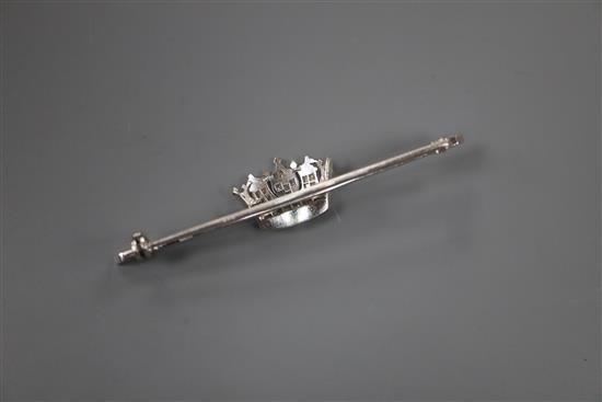 A mid 20th century white metal and diamond set coronet bar brooch, 56mm, gross 5 grams.